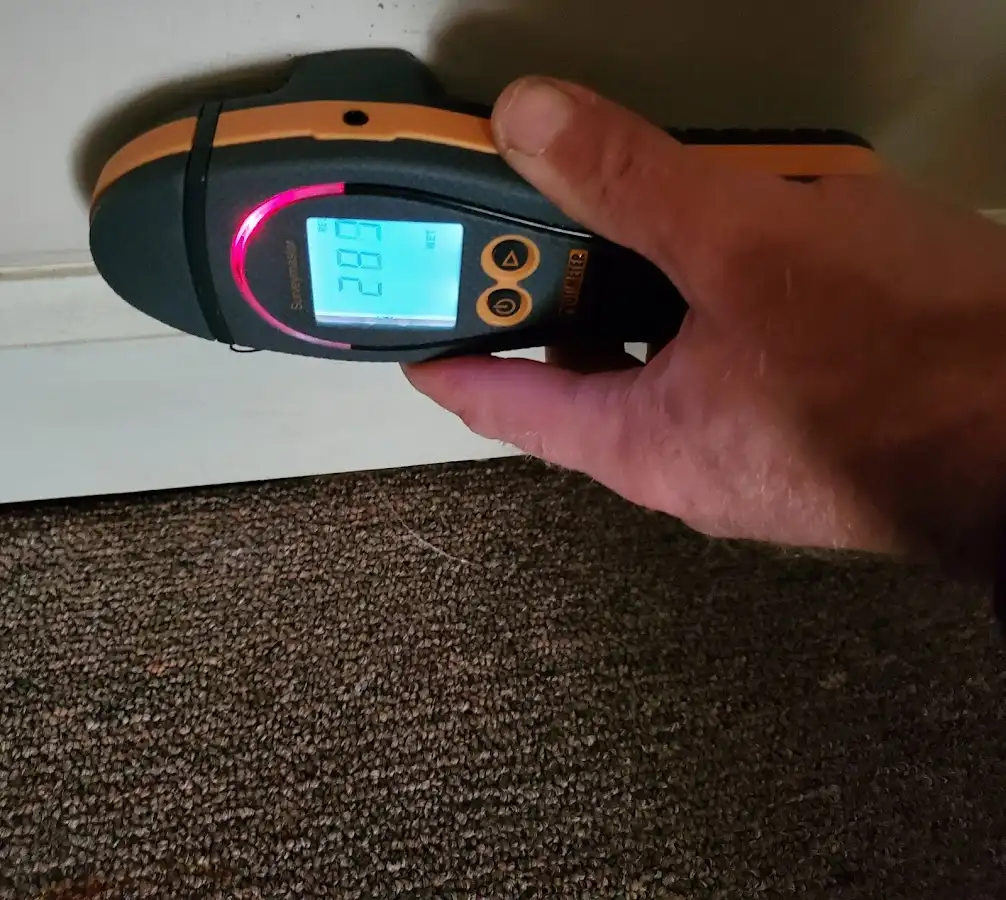 Moisture detection at baseboard during Storm Damage Restoration in Sparta